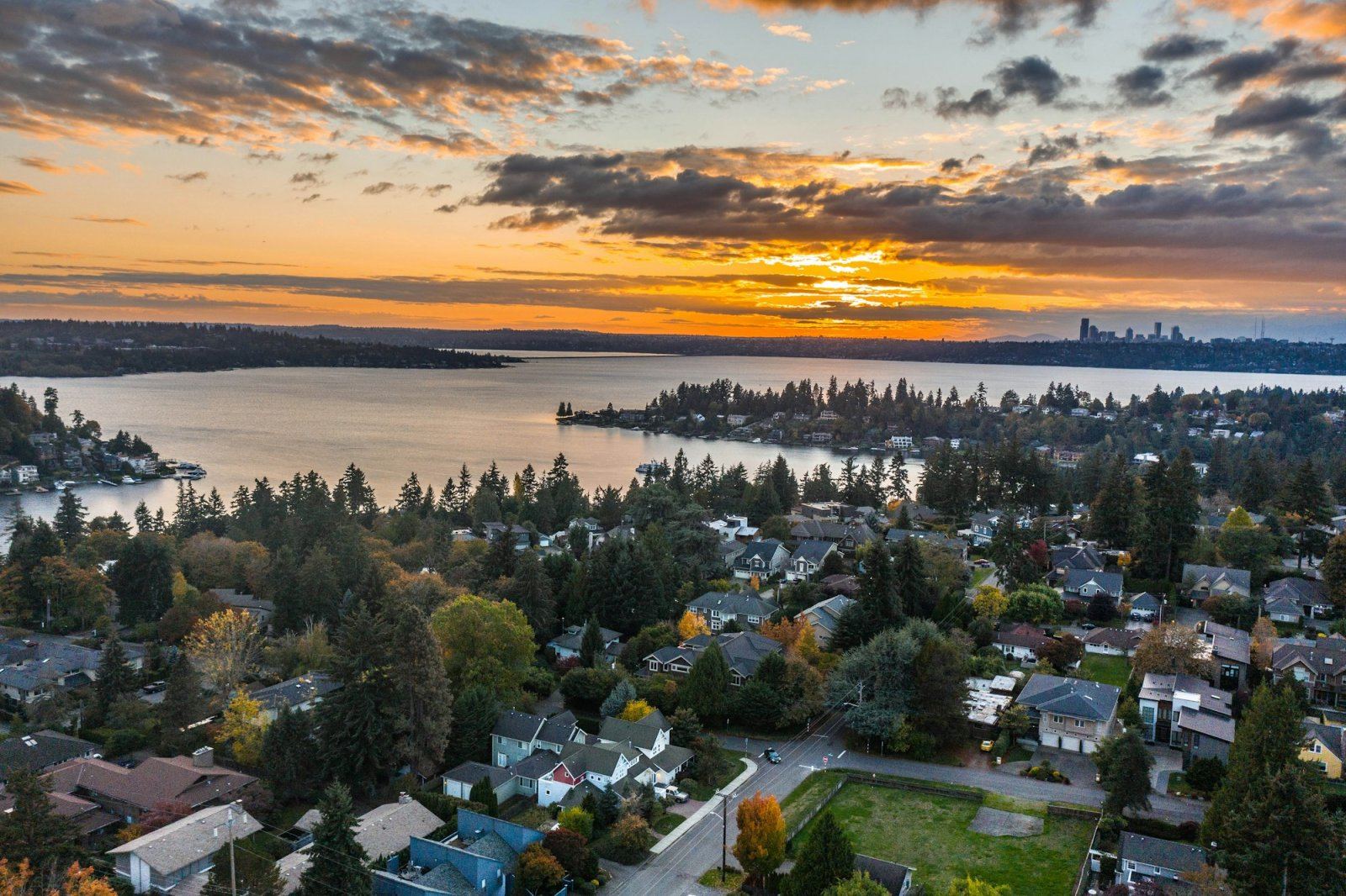 Aerial view of lakeside homes at sunset near Seattle