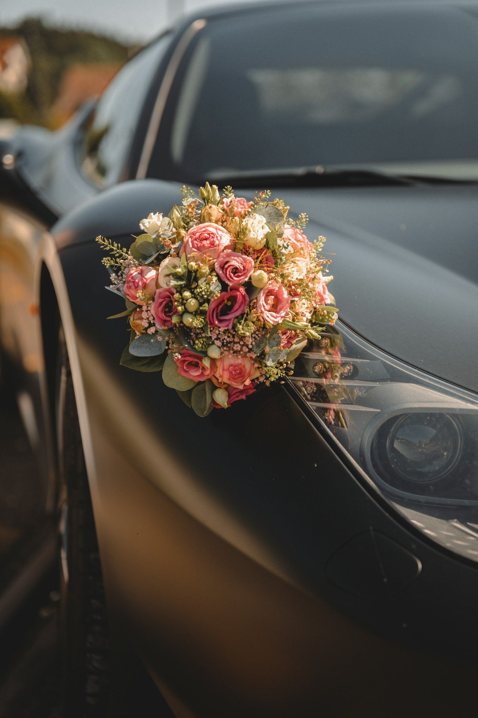 Bridal flowers decorating a wedding car